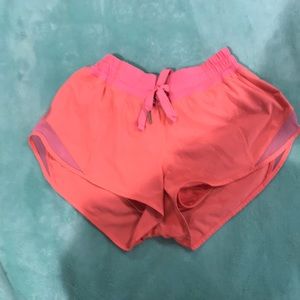 bright pink lululemon hotty hot short (3”)